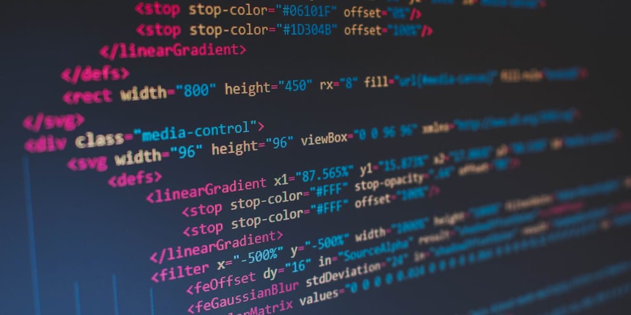 HTML source code on a monitor, similar to the view you see when inspecting a Shopify store page source for the theme name